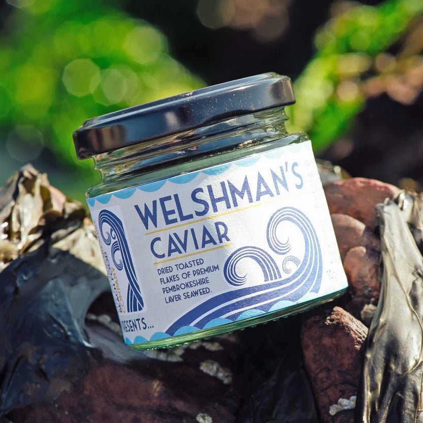 A jar of Welshman's Caviar Seaweed Condiment on the beach