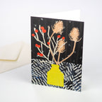 A greetings card featuring a stylised bouquet of winter berries and teasels in a yellow vase - All Good Things